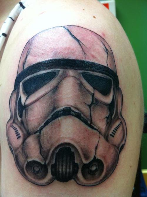 Grey Ink Stormtrooper Helmet Tattoo On Left Shoulder