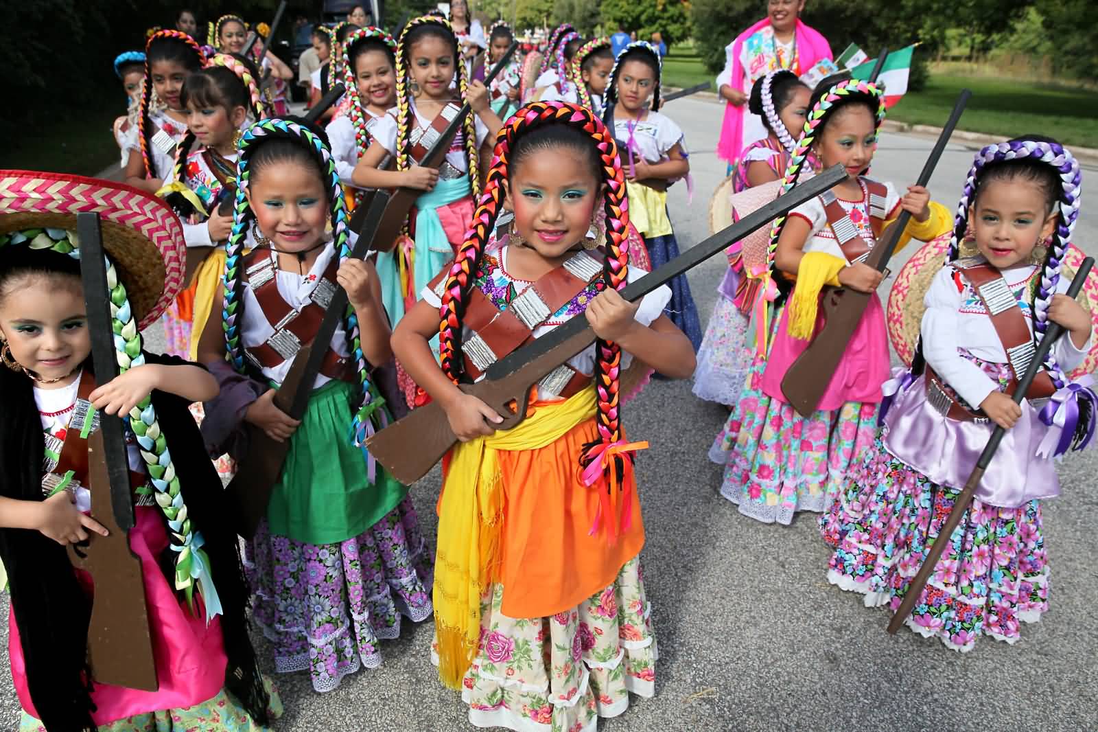Little Mexican Girls With Guns During Mexico Independence Day Celebration