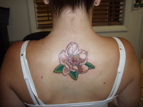 Magnolia Tattoo On Girl Upper Back