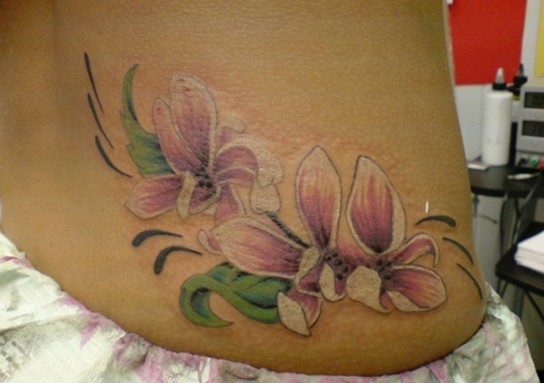 Magnolia Tattoo On Lower Back For Girls