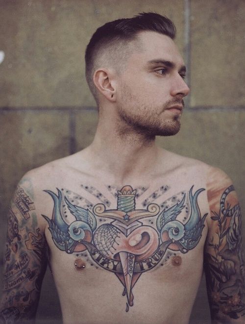 Old sailor style chest tattoo with birds and dagger