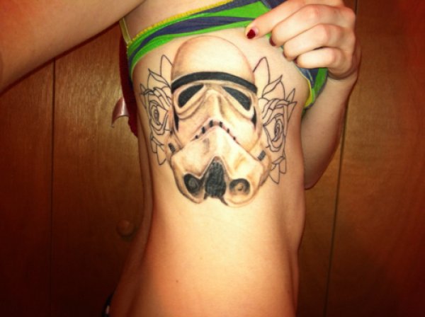 Outline Rose Flowers Stormtrooper Tattoo On Girl Side Rib