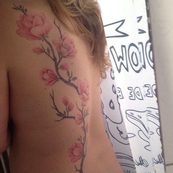 Pink Flowers Magnolia Tattoo On Girl Side Rib