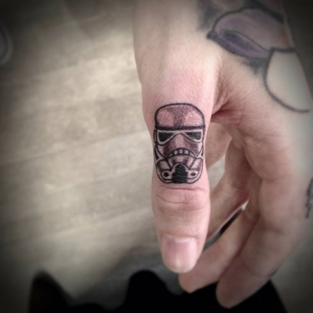 Small Stormtrooper Mask Tattoo On Thumb