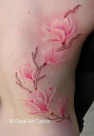 Watercolor Magnolia Tattoo On Side Rib by Duck Art