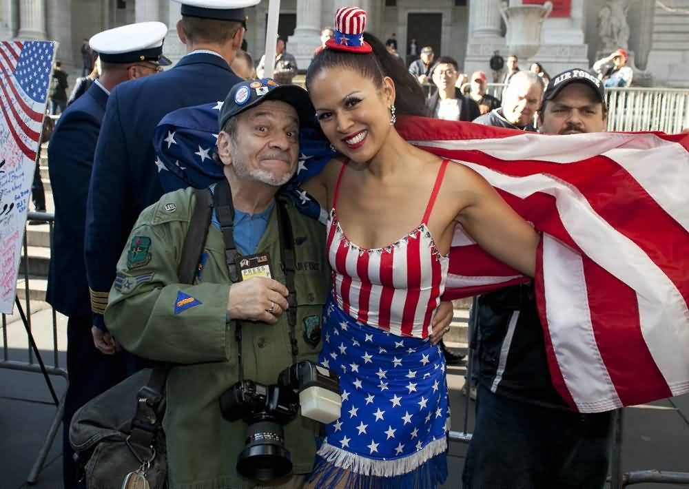 A Photographer With American Girl During Veterans Day Parade