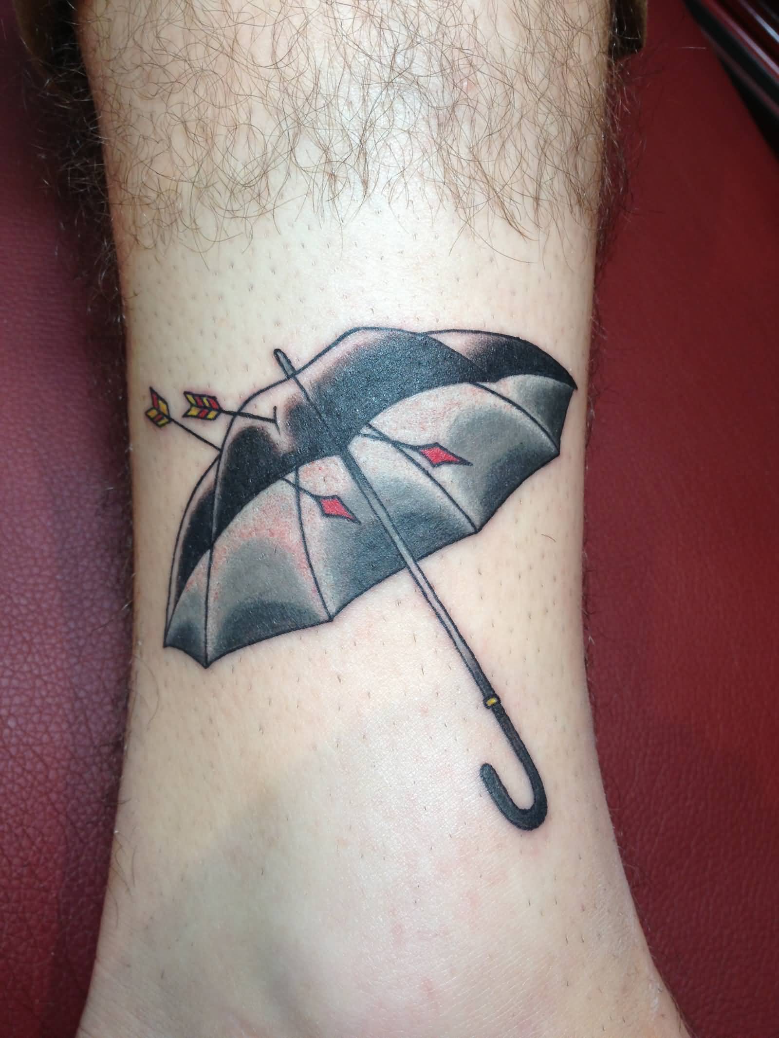 Arrows In Umbrella Tattoo On Leg