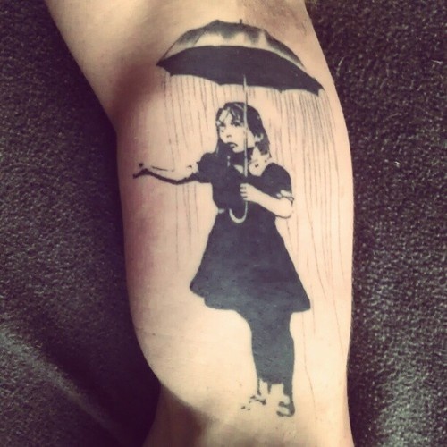 Banksy Umbrella Girl Tattoo On Bicep