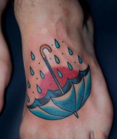 Blue Ink Umbrella Tattoo On Left Foot