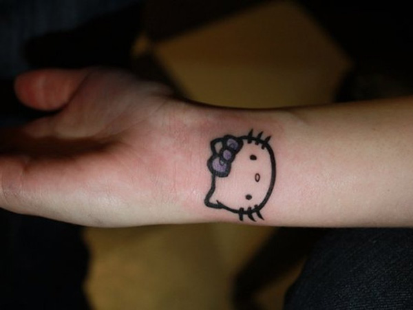 Bow Hello Kitty Tattoo On Right Wrist