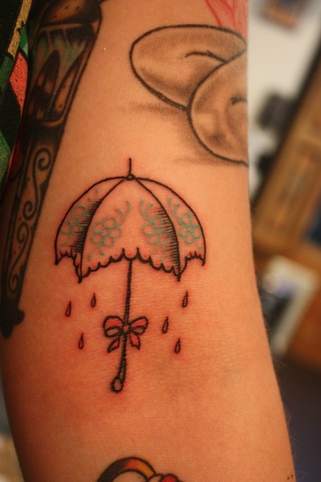 Bow With Umbrella Tattoo On Left Sleeve