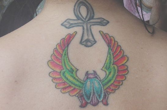 Colored Beetle And Ankh Tattoo On Upper Back