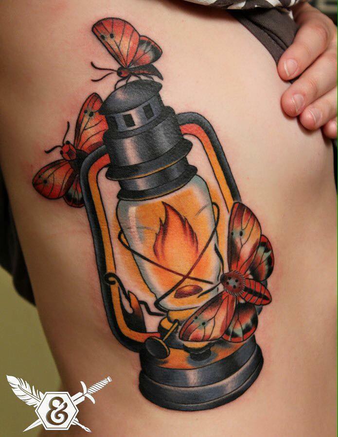 Colored Moths With Lamp Tattoo On Side Rib