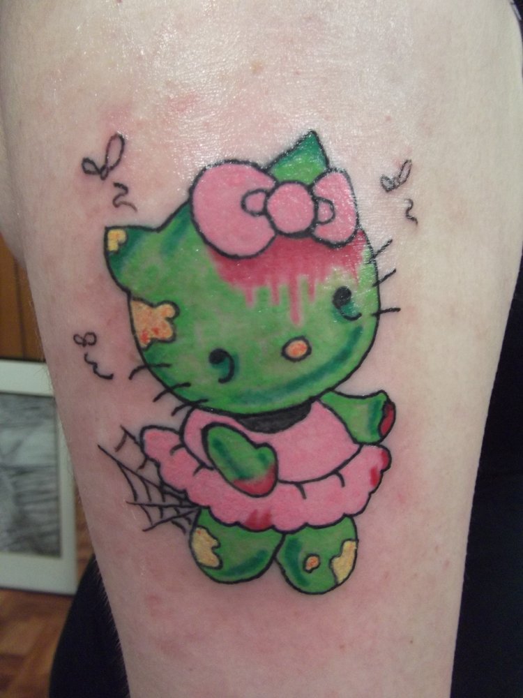 Colored Zombie Hello Kitty Tattoo On Bicep
