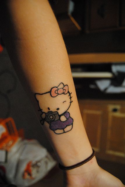 Cute Hello Kitty With Camera Tattoo