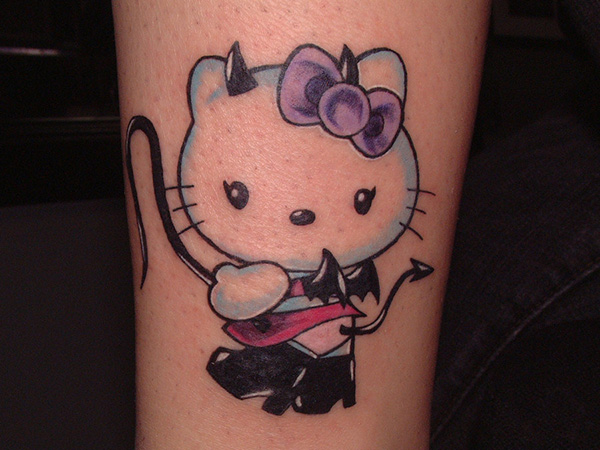 Devil Hello Kitty Bow Tattoo On Arm