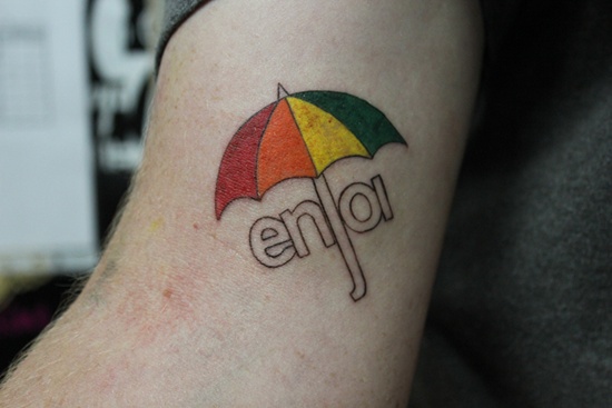 Enjoy Umbrella Tattoo On Bicep