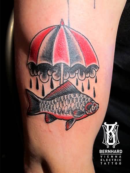 Fish Under Umbrella Tattoo On Right Bicep