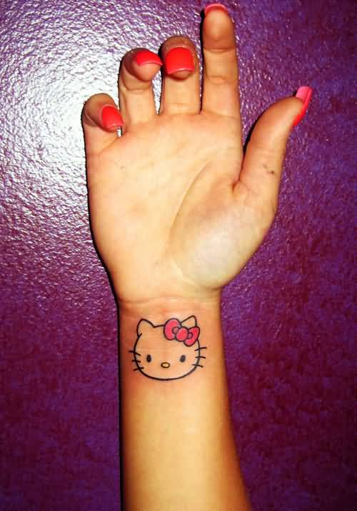Girl With Hello Kitty Tattoo On Wrist