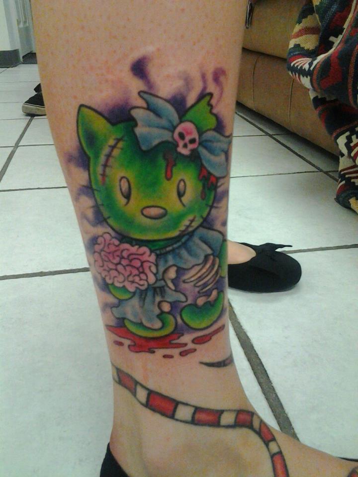 Green Ink Zombie Hello Kitty Tattoo On Leg by Spazi Gazi