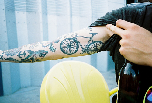 Guy Showing His Bicycle Tattoo On Bicep