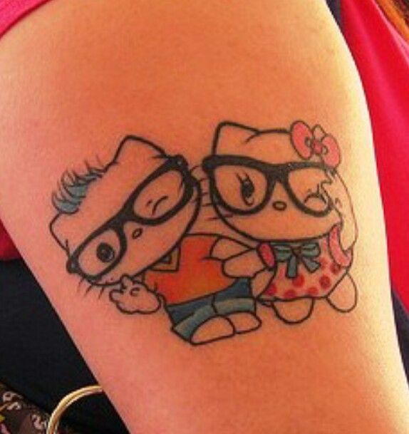 Hello Kitty Couple Tattoo On Left Bicep