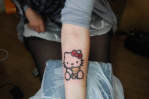 Hello Kitty Tattoo On Girl Left Forearm