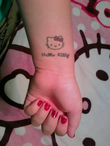 Hello Kitty Tattoo On Girl Left Wrist