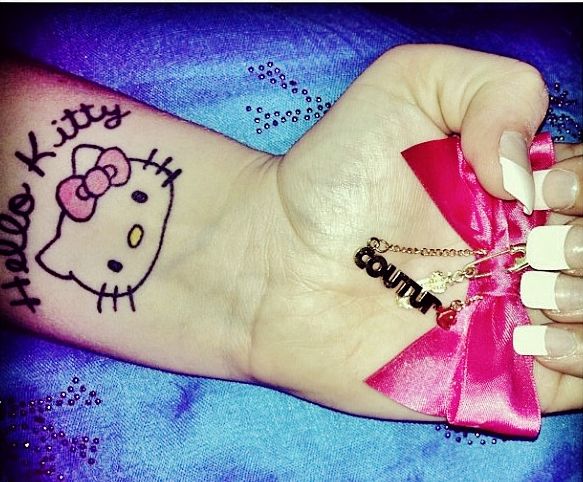 Hello Kitty Tattoo On Left Wrist
