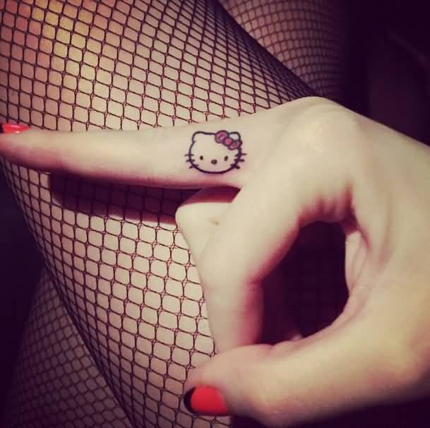 Hello Kitty Tattoo On Middle Finger