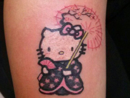 Japanese Hello Kitty Tattoo On Bicep
