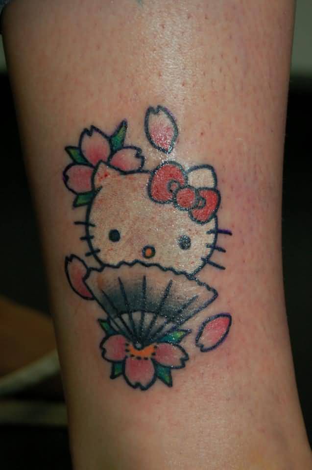 Japanese Hello Kitty Tattoo On Biceps