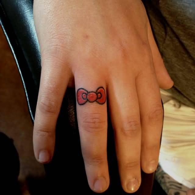 Nice Red Hello Kitty Bow Tattoo On Finger
