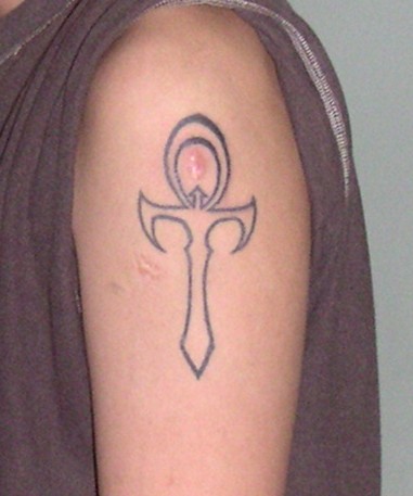 Outline Ankh Tattoo On Left Shoulder