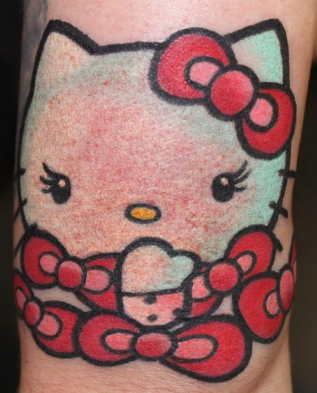 Red Bow Hello Kitty Tattoo On Sleeve