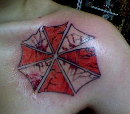Resident Evil Umbrella Tattoo On Front Shoulder