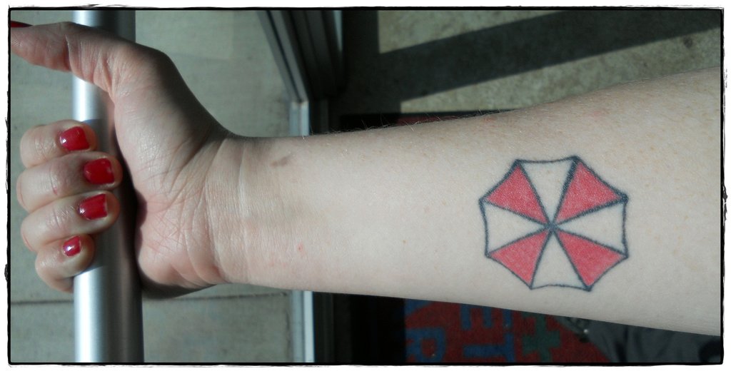 Resident Evil Umbrella Tattoo On Girl Forearm by Xcalibur1986