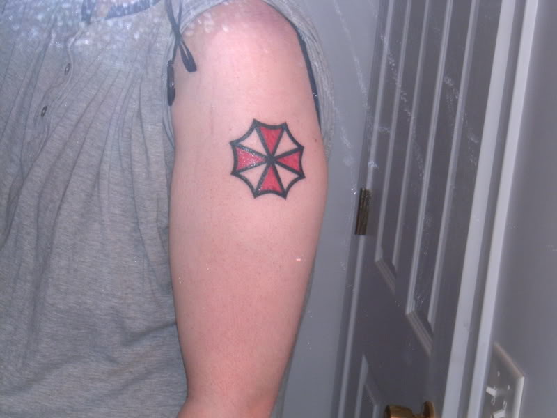 Resident Evil Umbrella Tattoo On Left Bicep