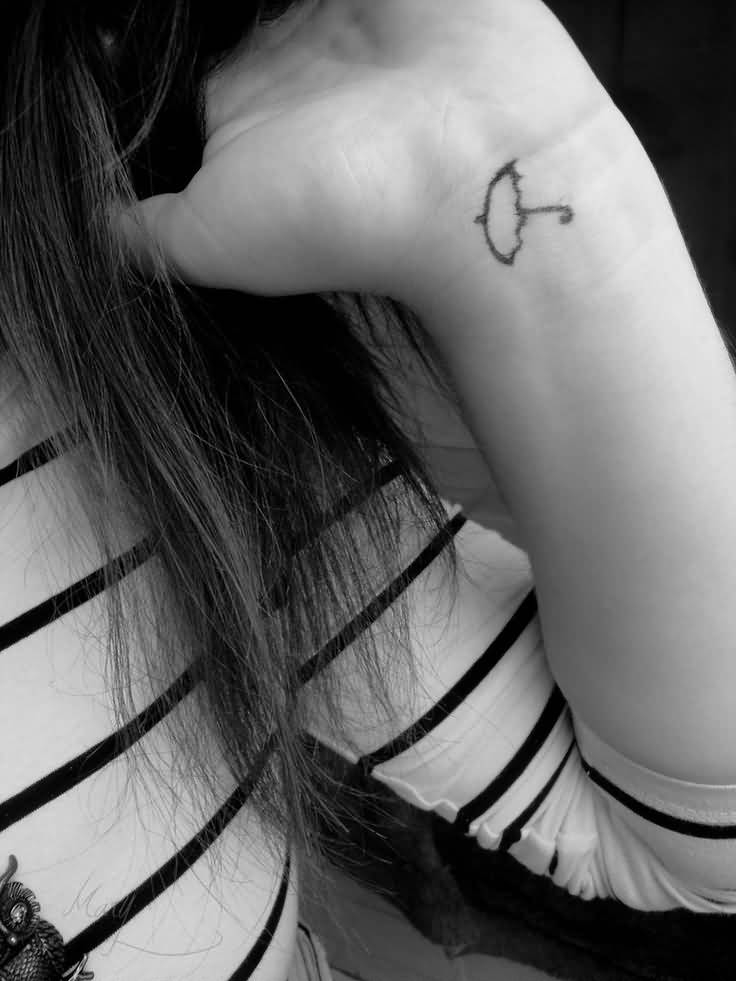 Simple Umbrella Tattoo On Girl Left Wrist