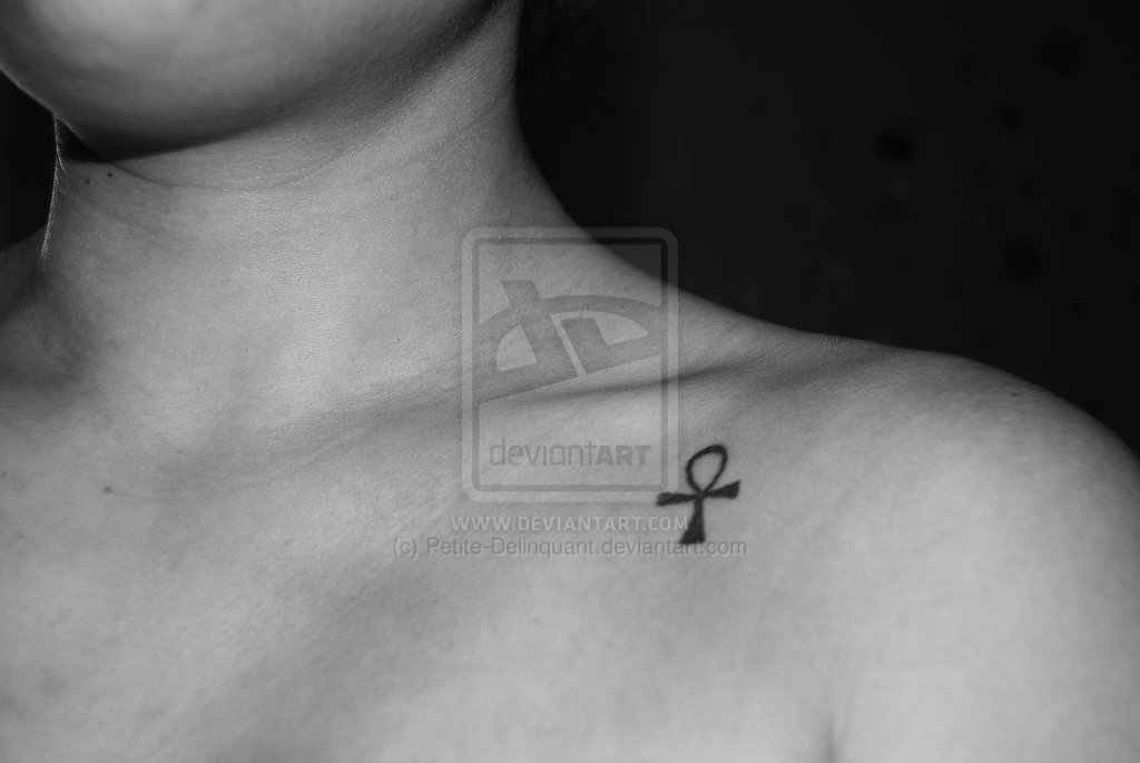 Small Black Ankh Tattoo On Front Shoulder