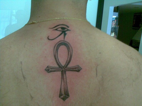 Small Horus Eye And Ankh Tattoo On Upper Back