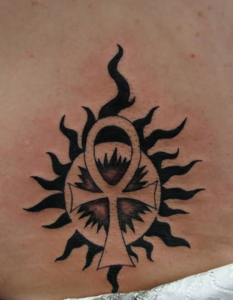 Tribal Sun And Ankh Tattoo On Lower Back