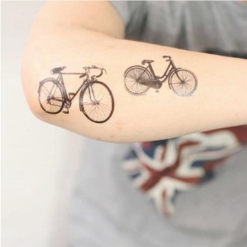 Two Bicycle Tattoos On Right Arm