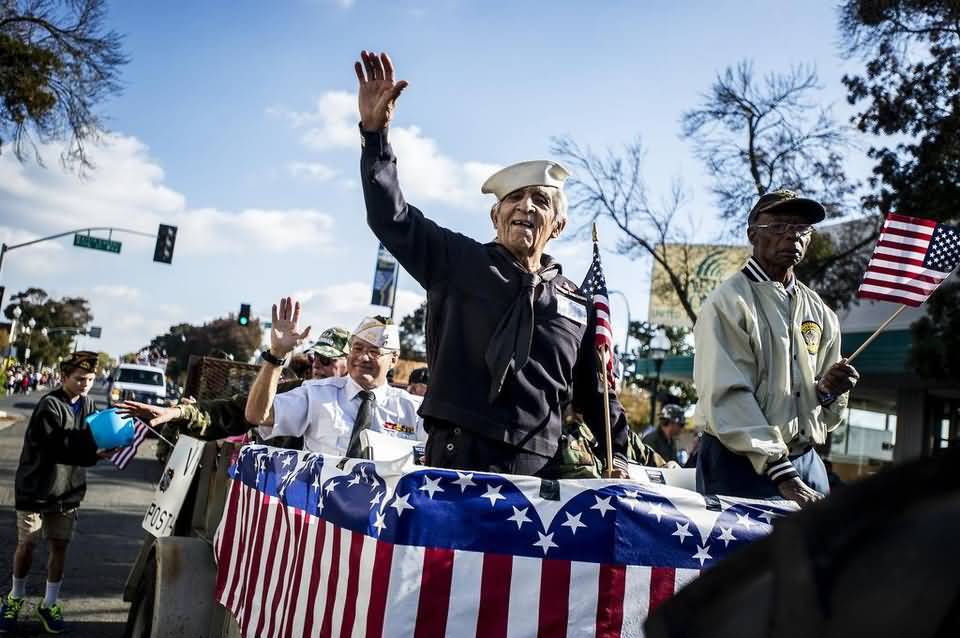 World War II Navy Veteran In A Float During Veterans Day Parade