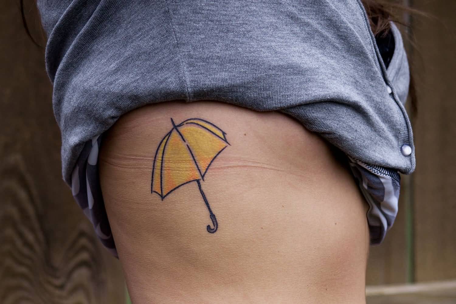 Yellow Umbrella Tattoo On Side Rib