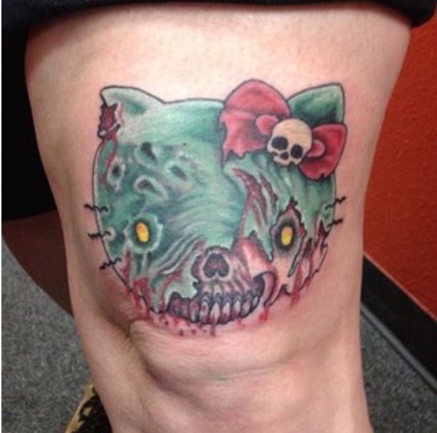 Zombie Hello Kitty Head Tattoo On Thigh