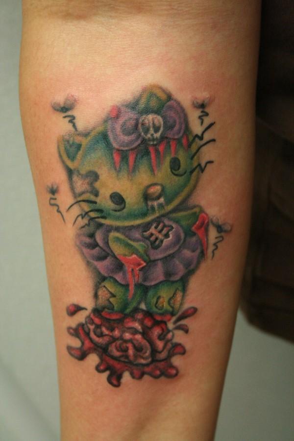 Zombie Hello Kitty Tattoo On Forearm by Roxiehart