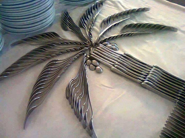 A palm tree created with spoons