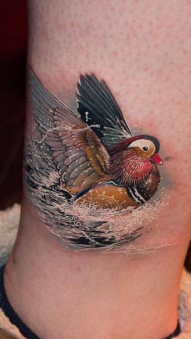 Awesome Color Ink Duck In Water Tattoo On Leg