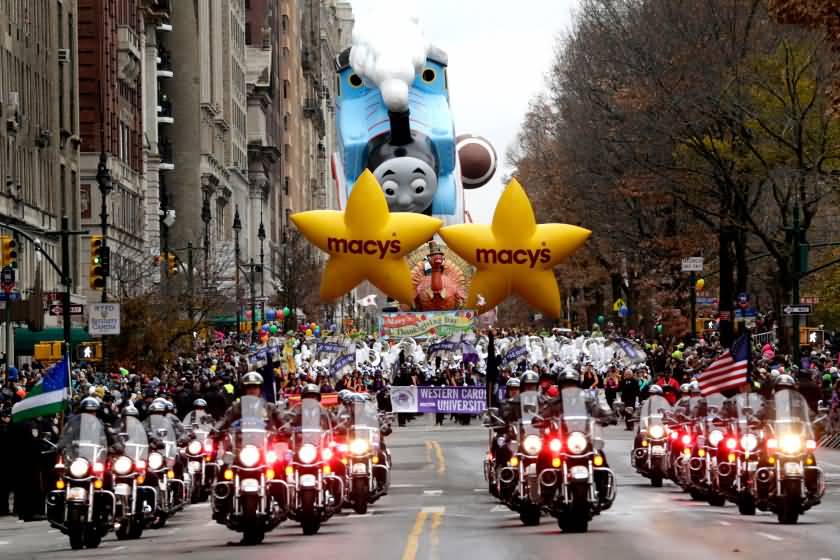 Bikers In Front Of Balloon Floats During Thanksgiving Day Parade